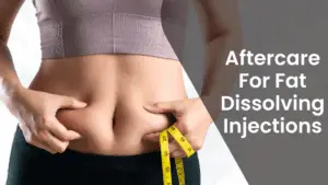 Person pinching their belly fat while holding a measuring tape near their waist, with the text "Aftercare For Fat Dissolving Injections" displayed to the right.