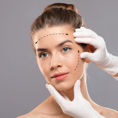 Aesthetic professional marking a woman's face for interior design-inspired cosmetic procedures.